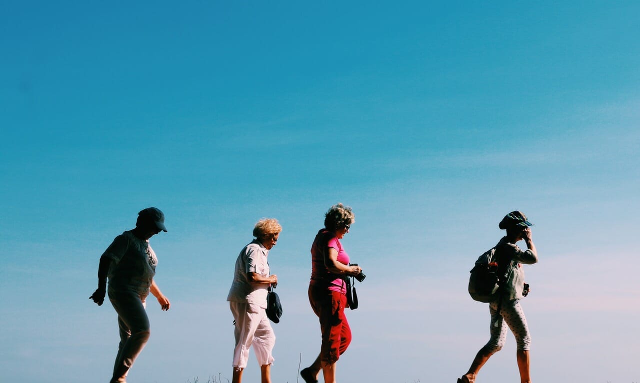 Group of seniors walking together outside