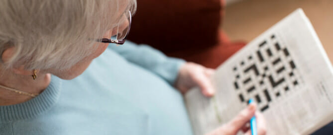 Senior woman doing crossword puzzle