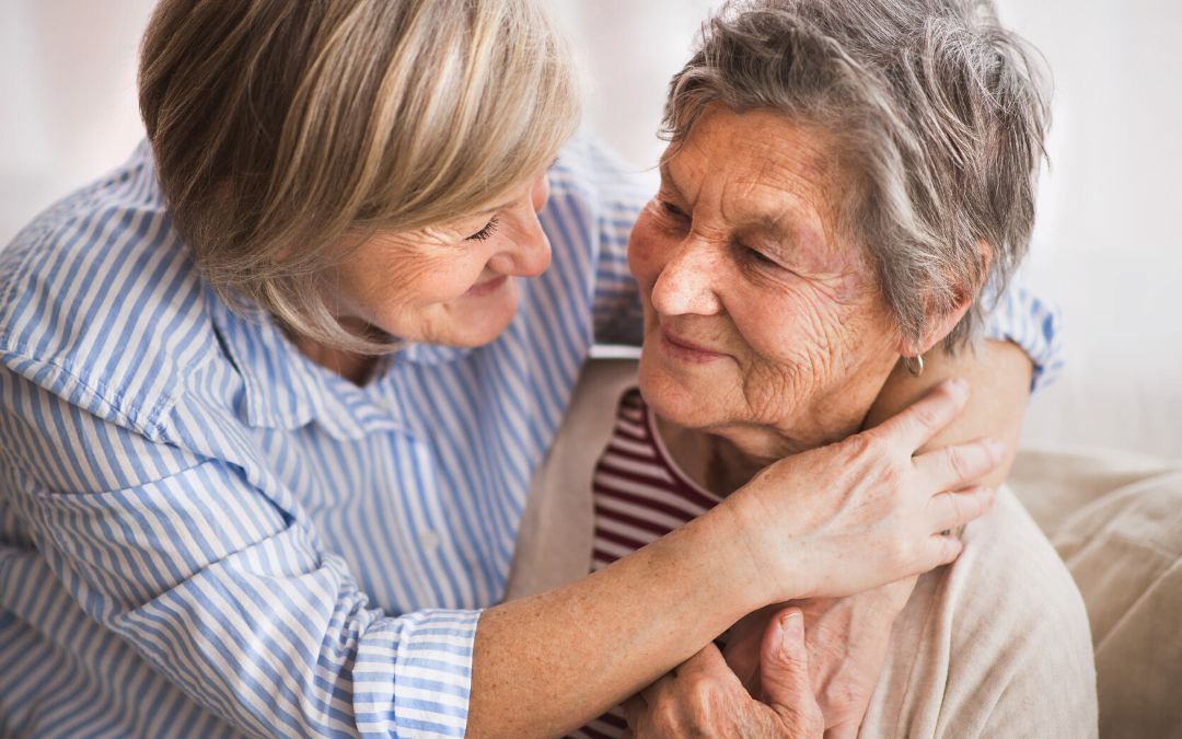 Senior women hugging